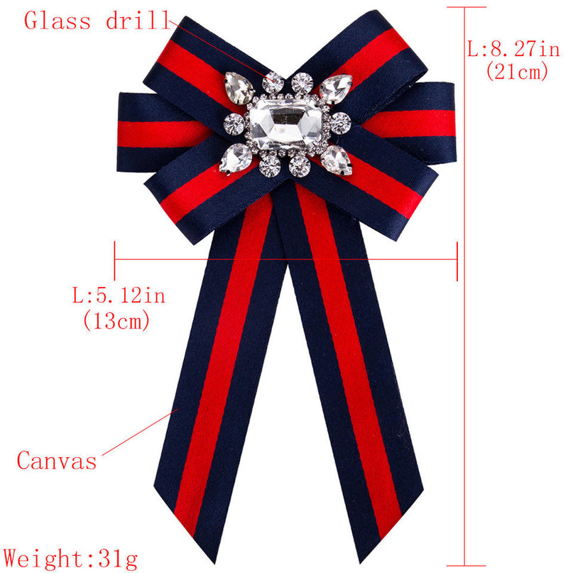 Jane wearing Red/Green fabric ribbon bow brooches with sparkling rhinestones for elegant outfit enhancement