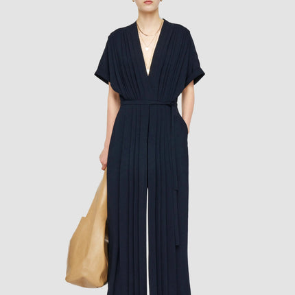 Jenna wearing Navy Blue Flared Sleeve Dress with V-Neckline and Natural Waist