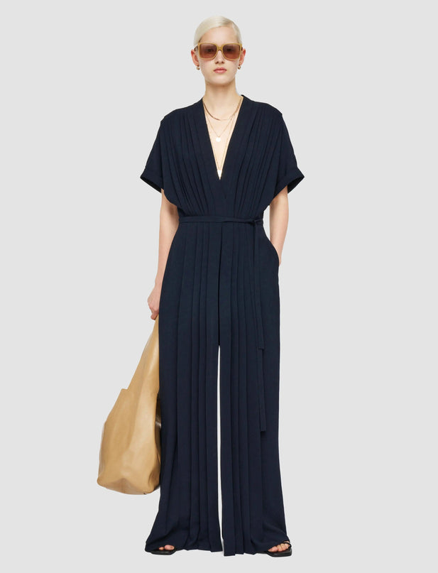 Jenna wearing Navy Blue Flared Sleeve Dress with V-Neckline and Natural Waist