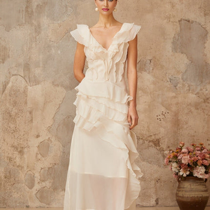 Jocelyn Maxi Dress Neutrals Ruffled Floral Elegance V-Neck Cap Sleeves Cinched Waist Faux-Flower Detailing Asymmetrical Hem Rear Zip Tie Fastening