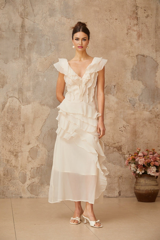 Jocelyn Maxi Dress Neutrals Ruffled Floral Elegance V-Neck Cap Sleeves Cinched Waist Faux-Flower Detailing Asymmetrical Hem Rear Zip Tie Fastening
