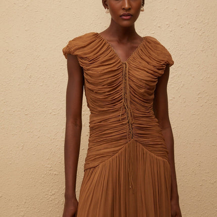 Julia Maxi Dress in luxurious Brown Chiffon V-neck Ruched Detailing Pleated Skirt Drawstring Neckline Cap Sleeves Fitted Waistline 100% Viscose Sophisticated Elegant Comfortable Rear Zip Fastening High-end Fashion Timeless Allure