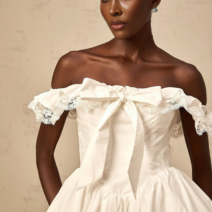 Julia White Off Shoulder Lace Mini Dress with Ruffled Detailing and Bow Accent
