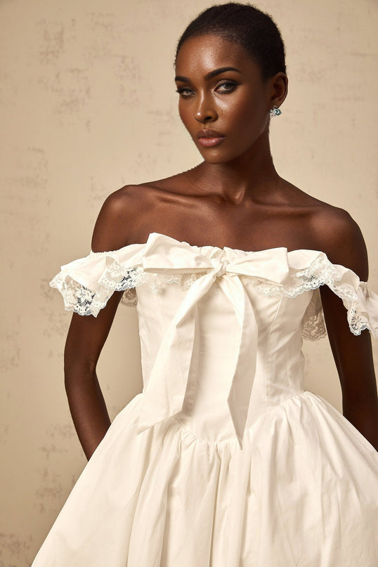 Julia White Off Shoulder Lace Mini Dress with Ruffled Detailing and Bow Accent