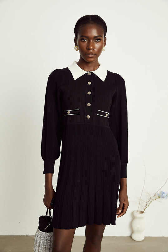 Juliana Black Ribbed Knit Mini Dress Balloon Sleeves A-line Faux Pocket Detail Flared Hem Press-stud Fastening 85% Terylene 15% Spandex