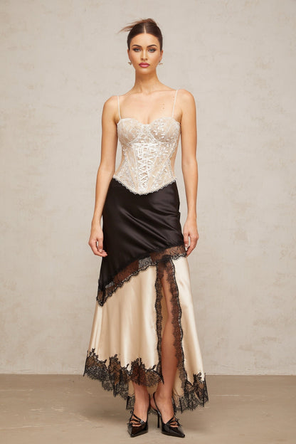 Karine bustier top with floral lace panelling against a plain background