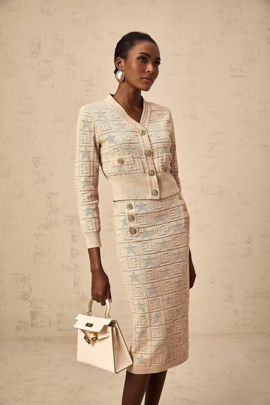 Khaki colored matching set featuring a cardigan and skirt with star pattern crochet knit design