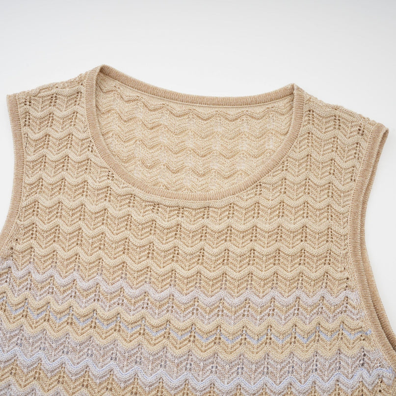 Laney Midi Dress in Neutrals ribbed-knitted texture sleeveless round neck silhouette contrasting colors ribbed trim versatile addition to wardrobe 55% Polyester 29% Cotton 16% Spandex