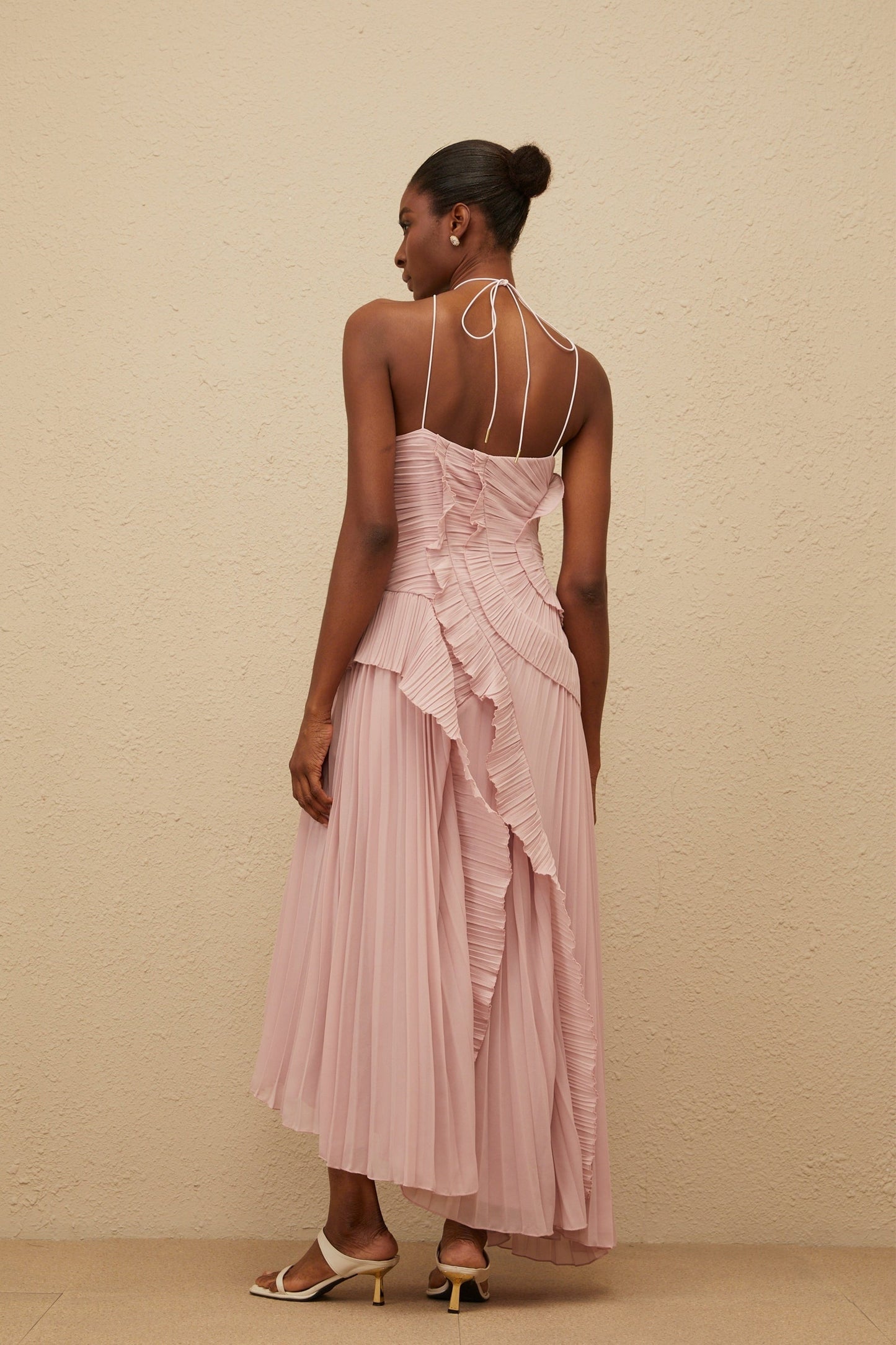 Lavender pink halterneck sleeveless midi dress with ruffled trim and asymmetrical design