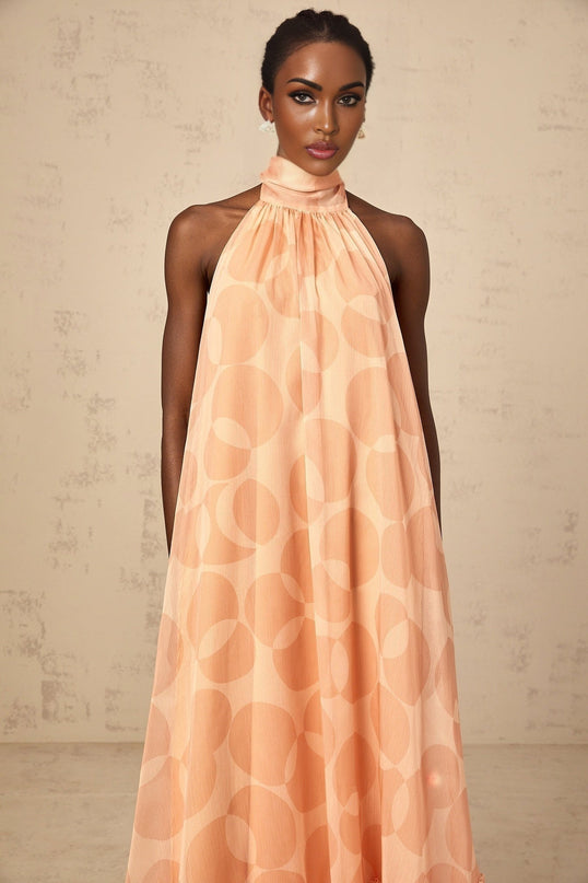 Layla Coral Pink Halterneck Maxi Dress with Ruffled Hem and Intricate Pattern Print