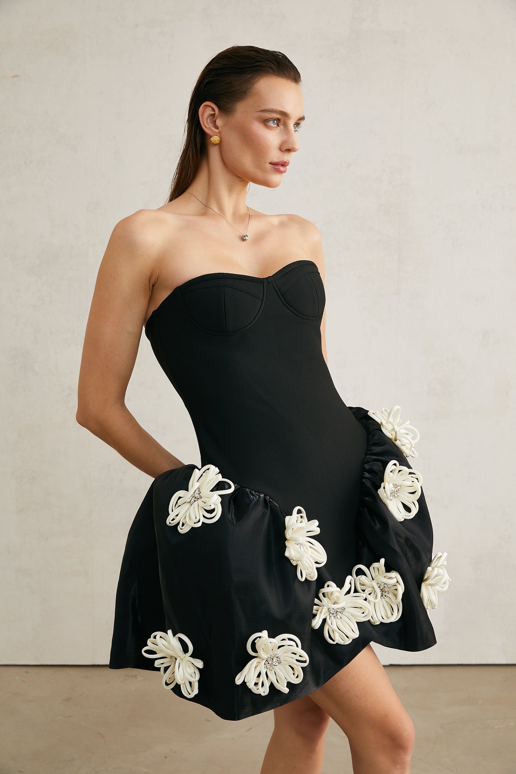 Léonor black floralappliqué peplum mini dress