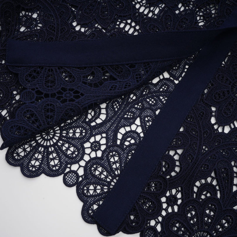 Lesly Floral Midi Dress in Dark Blue & White Crochet Lace Detailing Classic Collar Floral Appliqué Belted Waist Scalloped Hem Gold-Tone Buttons Flap Pockets Calf-Length Terylene Fiber