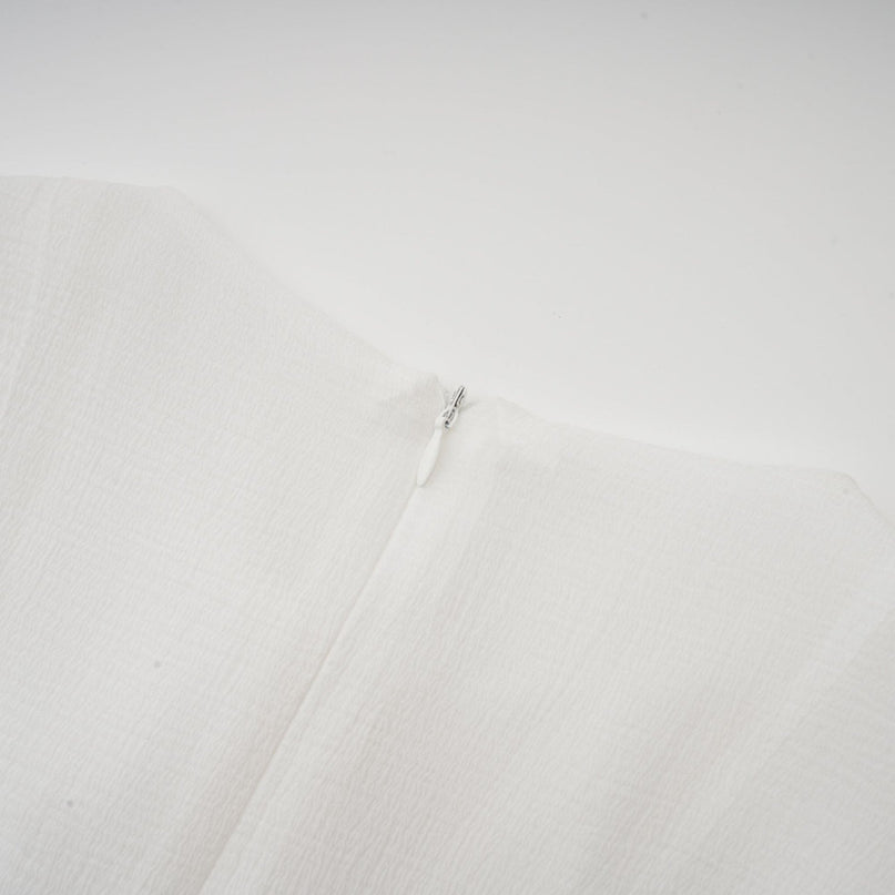 Letizia White Mini Dress with Flared Sleeves and Sheer Button Hem