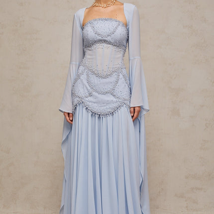 Light blue pleated maxi dress with faux pearl embellishments by Gaelle