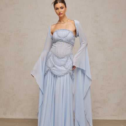 Light blue pleated maxi dress with faux pearl embellishments by Gaelle