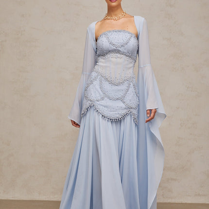 Light blue pleated maxi dress with faux pearl embellishments by Gaelle