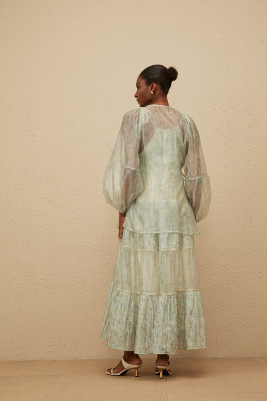 Light green V-neck cardigan with tie-dye print and long puff sleeves