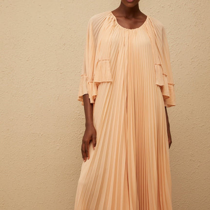 Lilah Midi Dress in Salmon Pink chiffon cape design ruffled detailing scalloped hem pleated silhouette calf-length cut sartorial masterpiece rear zip fastening Terylene fiber sizes fashion enthusiast