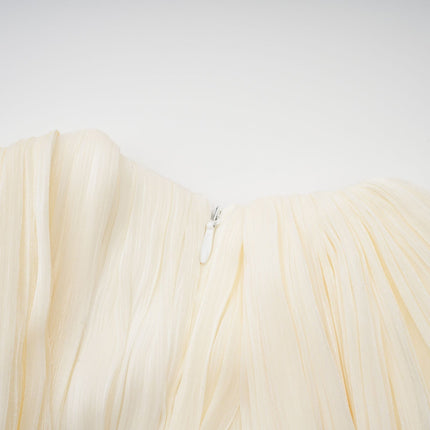 Lina Mini Dress in Neutrals pleated design with ribbon detailing and glitter accents