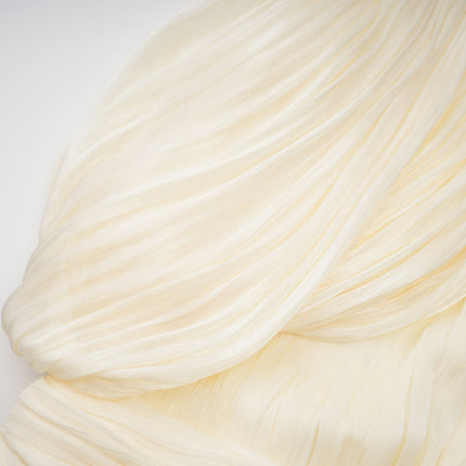 Lina Mini Dress in Neutrals pleated design with ribbon detailing and glitter accents asymmetrical silhouette cinched waist bubble hem round neck twist detailing rear zip fastening luxurious blend of Terylene fiber Viscose and Spandex