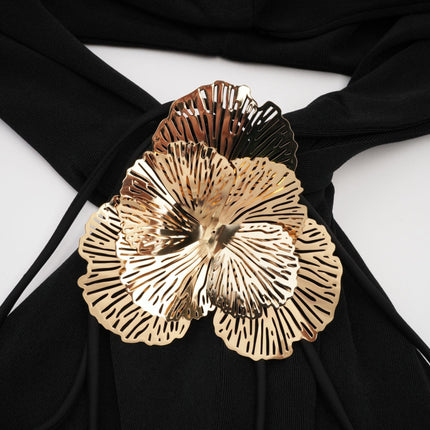 Long black maxi dress with hood and floral applique details