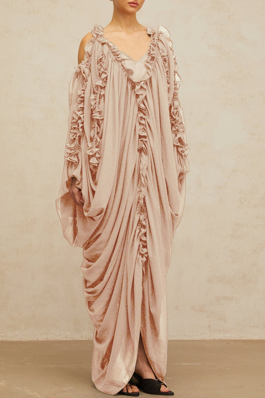 Long flowy white tulle maxi dress with ruffled trim details and delicate straps