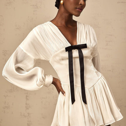 Lorelei White Glitter Bow V-Neck Mini Dress with Puff Sleeves and Pleated Design