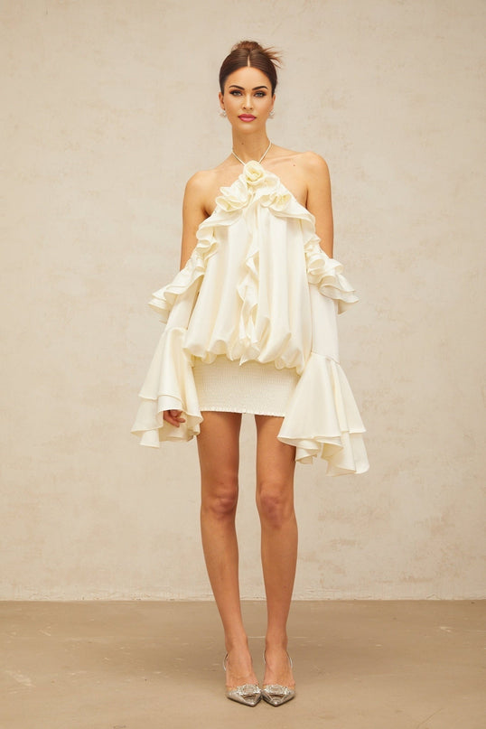 Ludovica Mini Dress in Neutrals halterneck ruffled eyelet embellishments flared sleeves cold shoulder design slip pockets shirred panel stretch skirt rear tie fastening daytime events evening soirées timeless charm modern allure