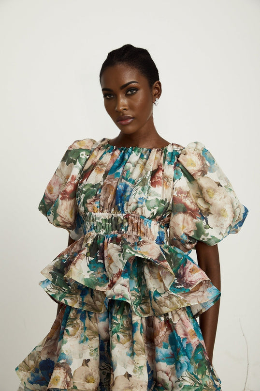 Lylah Floral Tiered Midi Dress in Neutrals Multicolor Linen Fabric Short Puff Sleeves Rear Zip Fastening Size M Model 5'10 Elegant Versatile Upscale Occasion