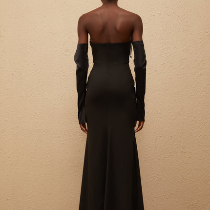 Mackenzie Maxi Dress in Black off-shoulder corset-style bodice slit cuffs flared hem boned bodice rear zip fastening 100% Terylene fiber special occasions femininity refinement
