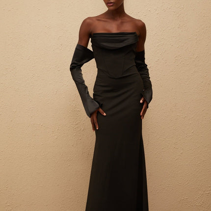 Mackenzie Maxi Dress in Black off-shoulder corset bodice slit cuffs flared hem boned rear zip fastening Terylene fiber dramatic silhouette special occasions femininity refinement