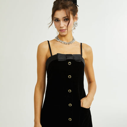 Madalynn Black Mini Dress with Bow Detailing and Front Button Accent