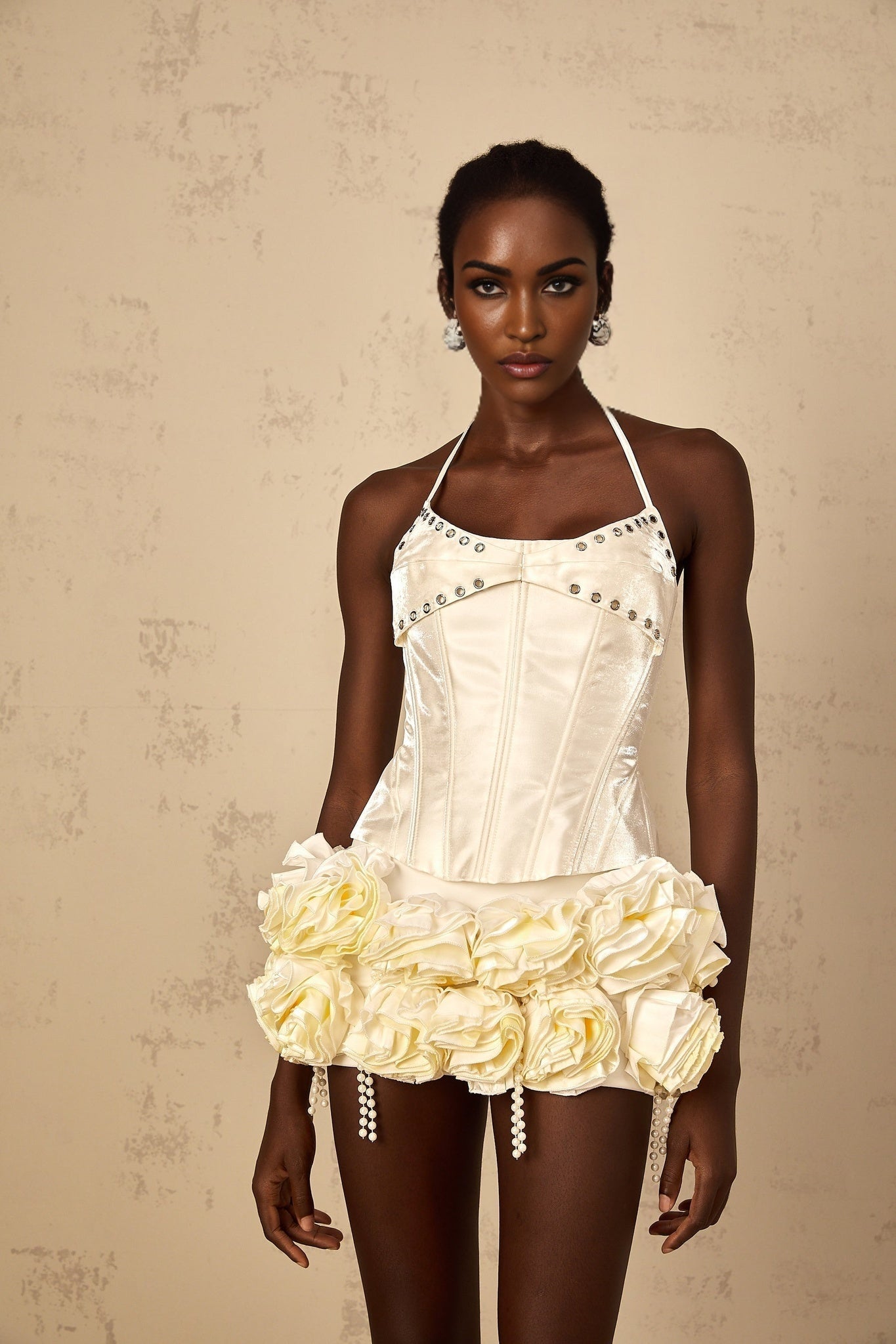 Madeleine matching set featuring a white floral corset top and skirt against a plain background