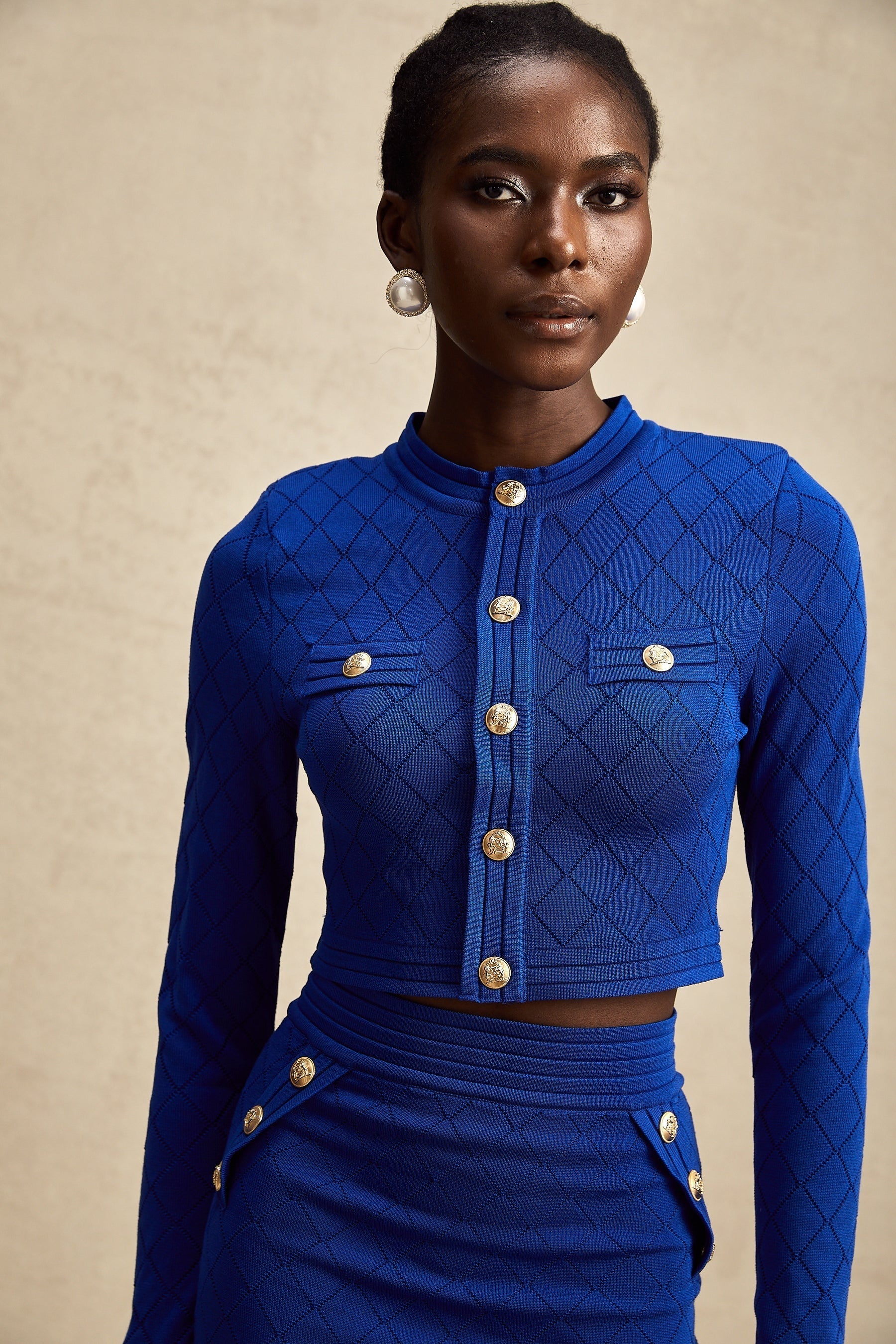 Maelys blue knitted matching set with top and skirt featuring button details