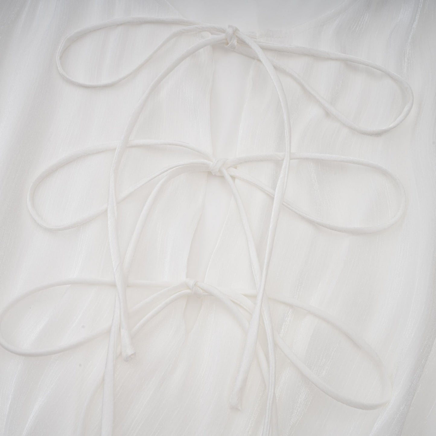 Mahault white pleated glittereffect mini dress