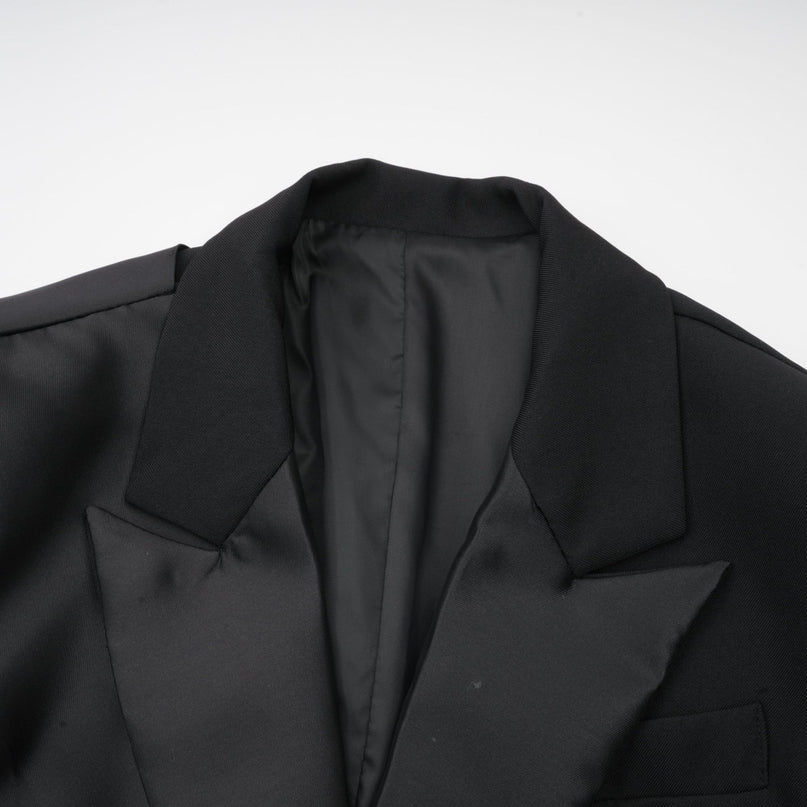 Mariangela Black Oversize Bow Tie Blazer with Peak Lapels and Cut-Out Design