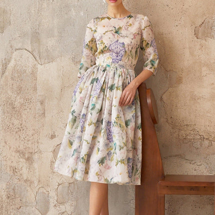 Marta Midi Dress in Neutrals floral print shirred effect flounce hem cinched waist half sleeves rear zip fastening 79% Terylene fiber 21% Silk