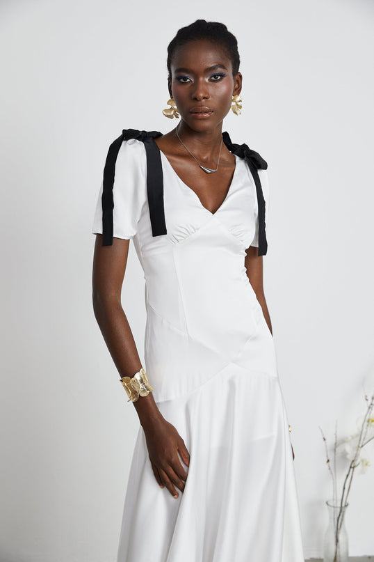 Mary White and Black Maxi Dress with V-Neck and Puff Sleeves 100% Polyester Ribbon Design Pleat Detailing Bowknot Embellishment Flared Hem Rear Zip Fastening