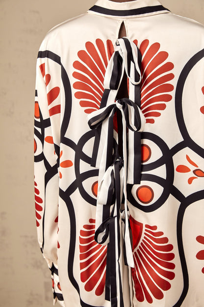 Matching set of Amaranta shirt and trousers with graphic print pattern