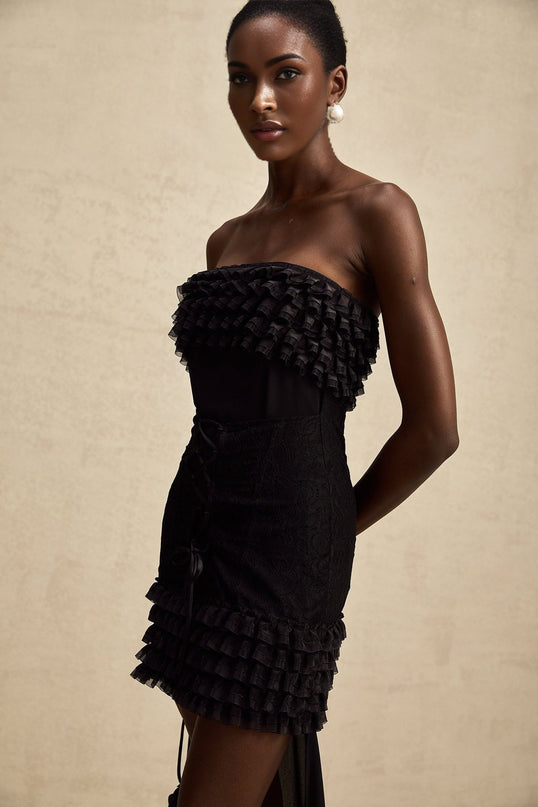 Michèle Black Strapless Mini Dress with Lace-up Detail and Tiered Frill Accents