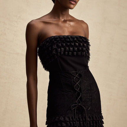 Michèle Black Strapless Mini Dress with Lace-Up Front and Frill Accents
