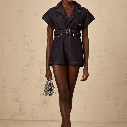 Michelle Belted Playsuit in Indigo Blue Denim V-Neck Epaulet Design Contrast Stitching Detachable Waist Belt Chest Inset Pockets Side Slit Pockets Button Fastening 70% Cotton 30% Terylene Fiber