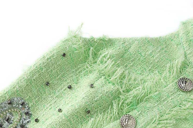 Vibrant mint green halter neck dress with rhinestone accents and button closure