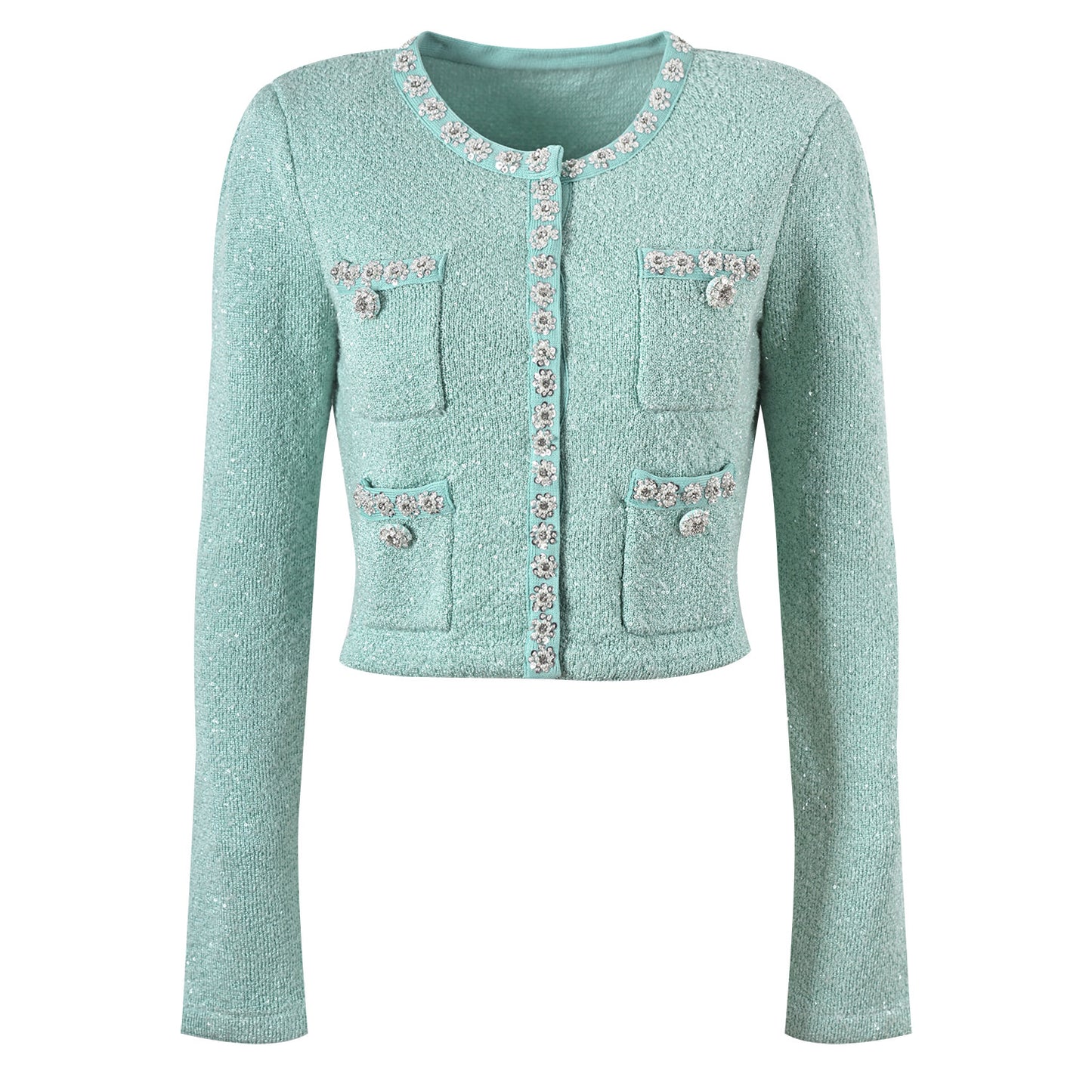 Mint green tweed jacket with floral embellishments paired with a pleated skirt, creating a chic and elegant look
