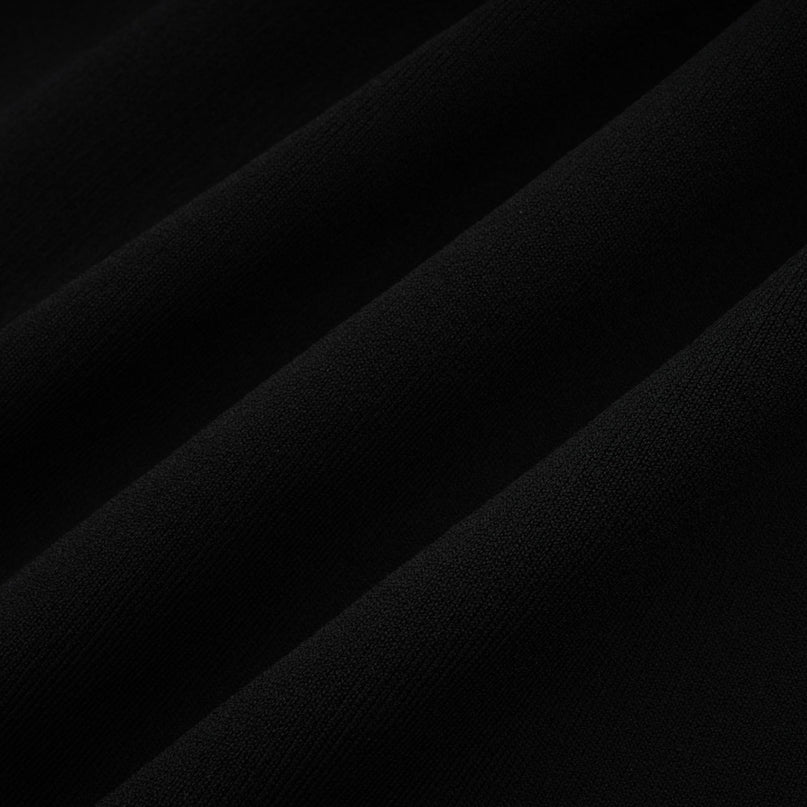 Miracle Mini Dress in Black & White off-shoulder design with crystal bow accent, thigh-length with contrasting colors and crystal embellishments, model in size M, 51% Viscose, 35% Terylene, 13% Nylon, 2% Elastane