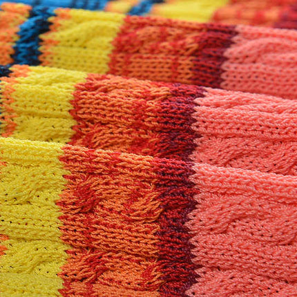Multicolor striped bodycon dress in bright reds, greens, yellows, and blues for summer wear