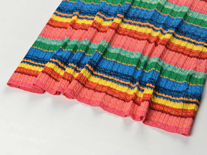 Multicolor striped bodycon dress in bright reds, greens, yellows, and blues for summer wear