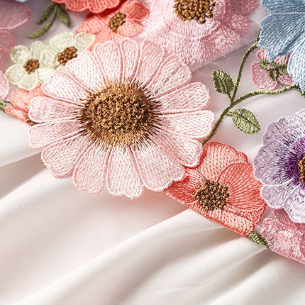 Multicolored floral embroidered A-line skirt with high-waist in soft pastel palette and vibrant accents