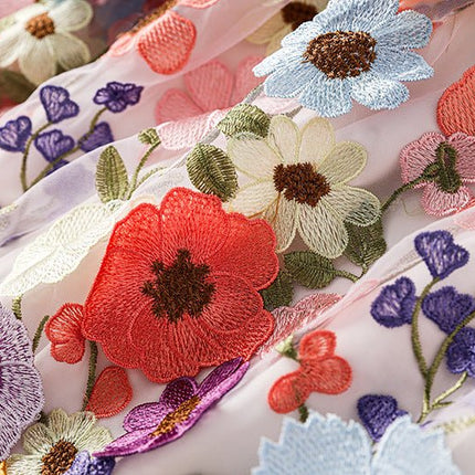 Multicolored floral embroidered A-line skirt in soft pastel palette with vibrant accents