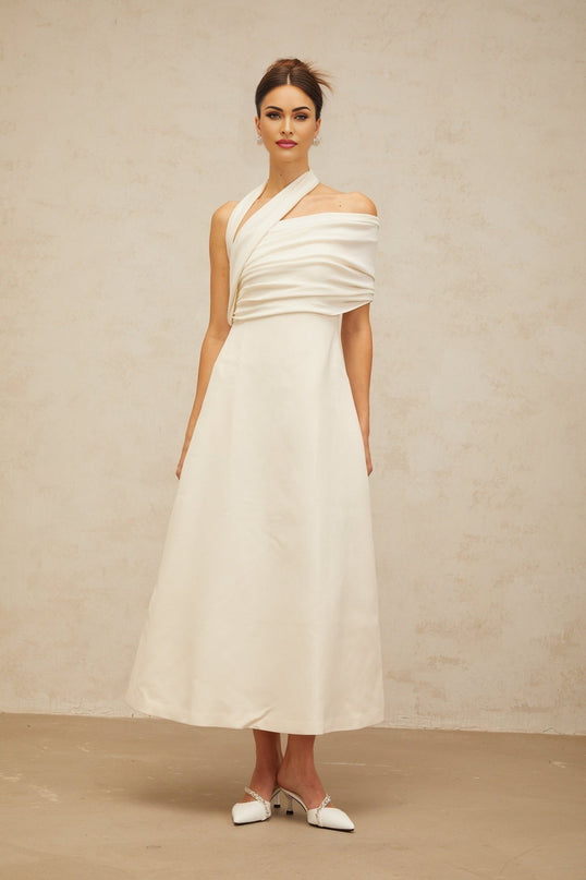 Nadia Cream White Maxi Dress with Asymmetric Halterneck Design and Flared Skirt